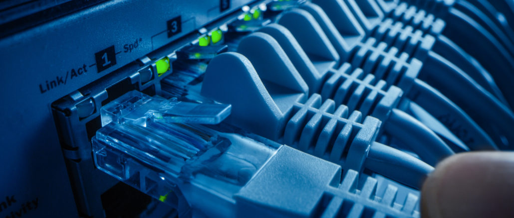 Close-up,Macro,Shot:,Person,Plugs,In,Rj45,Internet,Connector,Into