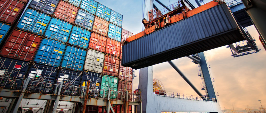 Container,Loading,In,A,Cargo,Freight,Ship,With,Industrial,Crane.